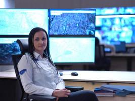 portrait of Female operator in a security data system control room photo