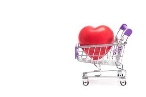 Heart in shopping basket trolley concept for Valentine gift photo