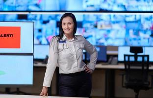 portrait of Female operator in a security data system control room photo