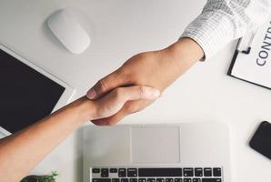 Top view of a strong handshake between man and woman photo