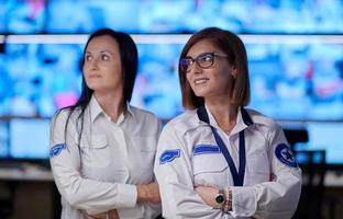 group portrait of Female operator in a security data system control room photo