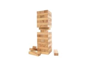 Wooden blocks tower game isolated on white photo