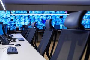 Empty interior of big modern security system control room photo