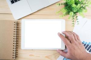 Tablet with isolated screen in man hands photo