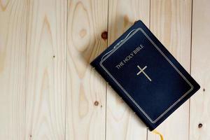 holy bible on wood table photo