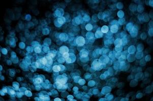 Abstract blur blue bokeh background with black background photo