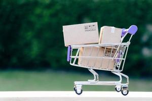 Paper boxes in a trolley with copy-space,Shopping online concept photo