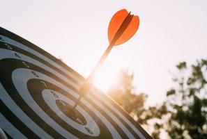 Target dart and arrow with abstract nature bokeh blur background photo