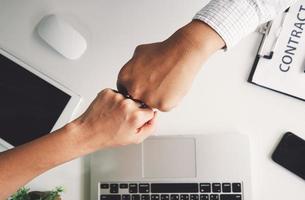 Business partnership giving fist bump to Start up new project