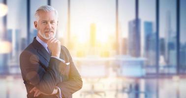 Senior businessman in his office photo