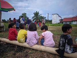 children playing together, east kalimantan, indonesia, august, 13,2022 photo