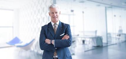 Senior businessman in his office photo