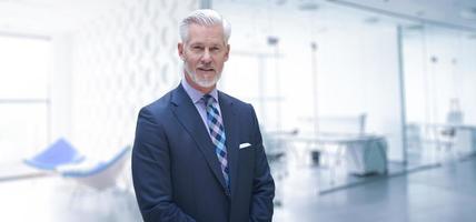 Senior businessman in his office photo