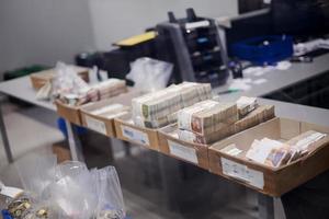 Carton boxes filled with sorted money photo