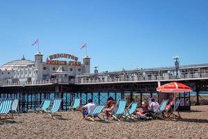 Brighton, East Sussex, UK - AUGUST 5, 2022. View of the pier in Brighton on August 5, 2022. Unidentified people photo