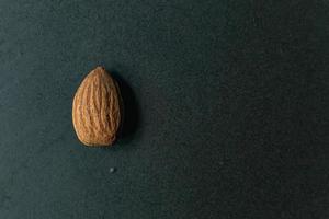 The Almond on black Ceramic Plate close up image. photo