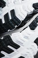 The sole of the sports sneakers for running in black and white close-up photo