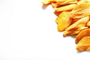 Dried mango sliced on a white background with free space photo