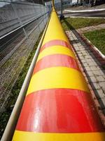 Yellow-red main line of the natural gas supply pipeline to the consumer photo