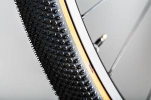 Shallow tread of a bicycle tubeless tire with a brown sidewall photo