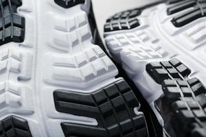 The sole of the sports sneakers for running in black and white close-up photo