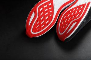 Close-up of the sole of a sport running shoe for running in red photo