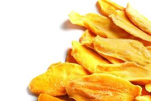 Dried mango sliced on a white background with free space photo