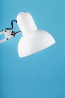 Classic table lamp on blue background with space for text and idea concept photo