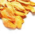 Dried mango sliced on a white background with free space photo