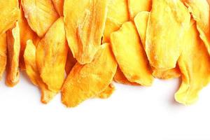 Dried mango sliced on a white background with free space photo