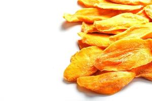 Dried mango sliced on a white background with free space photo