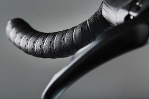 Steering wheel winding with brake handle of a road bike close-up photo