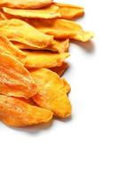 Dried mango sliced on a white background with free space photo