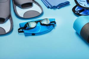 Set for training and learning to swim in the pool and open water on a blue background photo