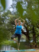 woman meditating and doing yoga exercise photo