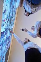 Female security guards working in a security data system control room photo