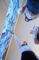 Female security guards working in a security data system control room photo