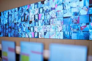 Empty interior of big modern security system control room photo