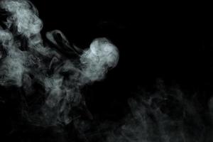 Abstract powder or smoke isolated on black background photo