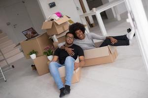 African American couple  playing with packing material photo