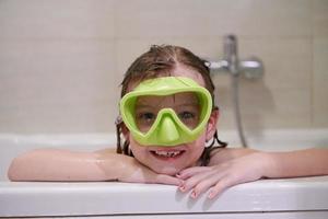 little girl with snorkel goggles photo