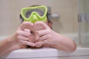 little girl with snorkel goggles photo