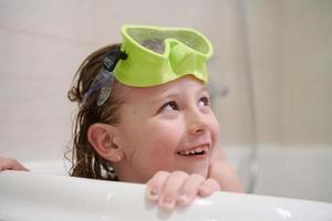 little girl with snorkel goggles photo