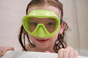 little girl with snorkel goggles photo