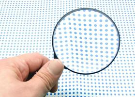 hand with magnifying glass photo