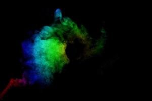 Abstract smoke isolated on black background,Rainbow powder photo