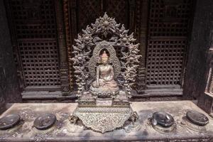 The bronze Buddha statue in Nepalese style. Buddha statues are the representations of Lord Buddha himself. photo