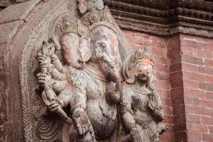The stone sculpture of Ganesha the lord of success in Hindu religion, Kathmandu, Nepal. Ganesha is one of the best-known and most worshipped deities in the Hindu pantheon. photo