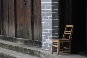 Old chair in front of Chinese vintage house photo