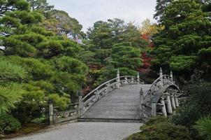 Old royal Japanese stone bridge in Autumn photo